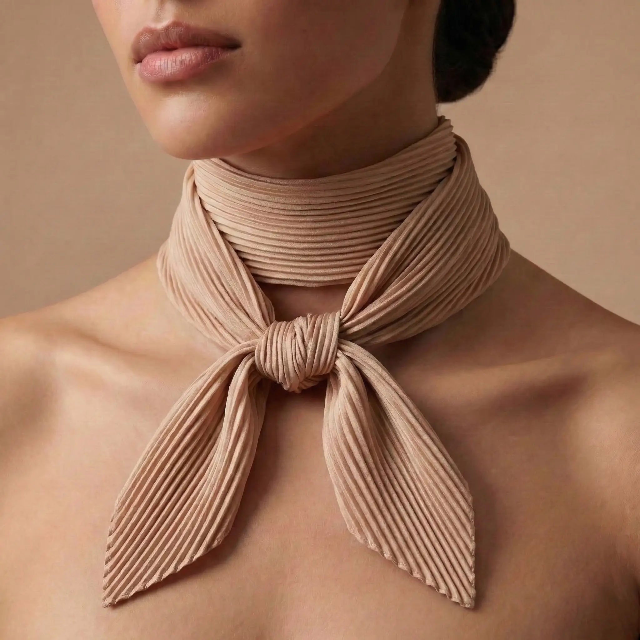 Beige pleated silk scarf in Brown Scarf collection tied neatly around neck Image