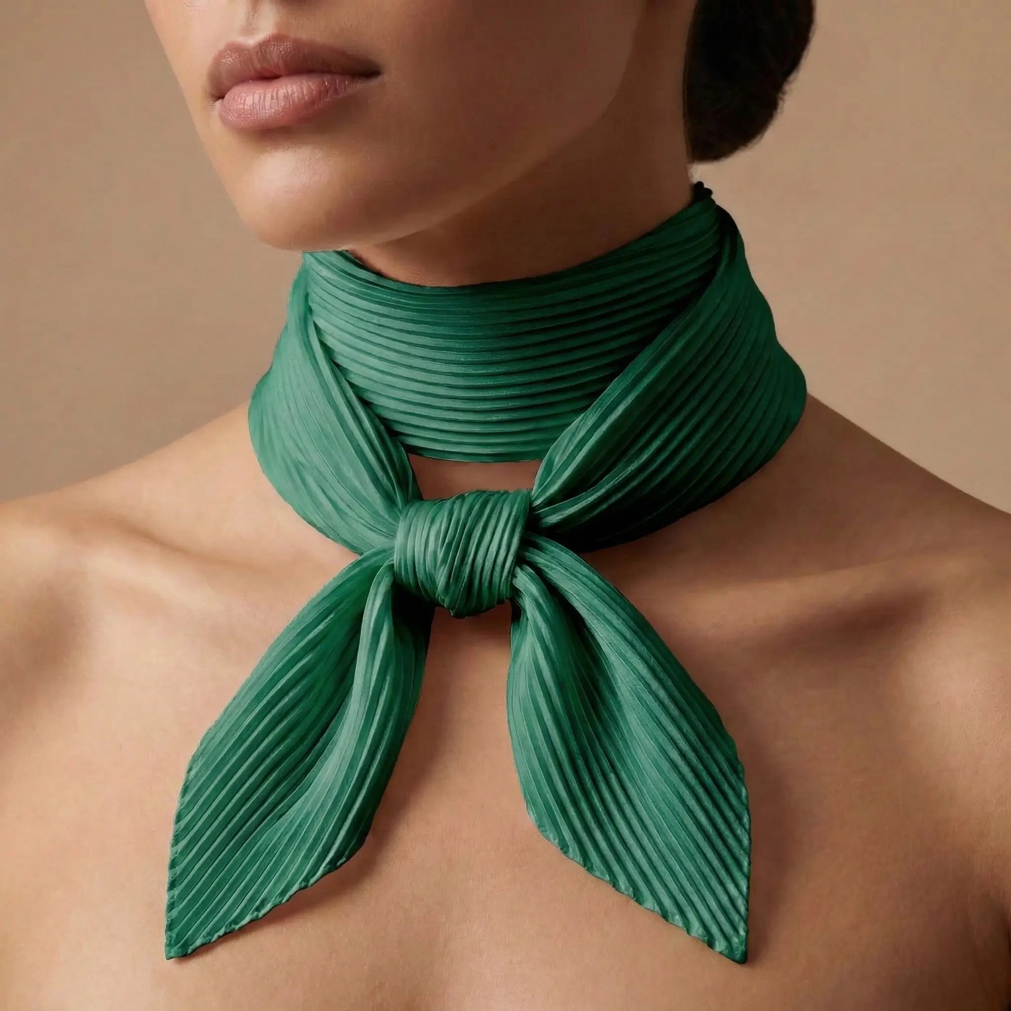 Emerald green pleated silk scarf from Green Scarf collection tied neatly around neck Image