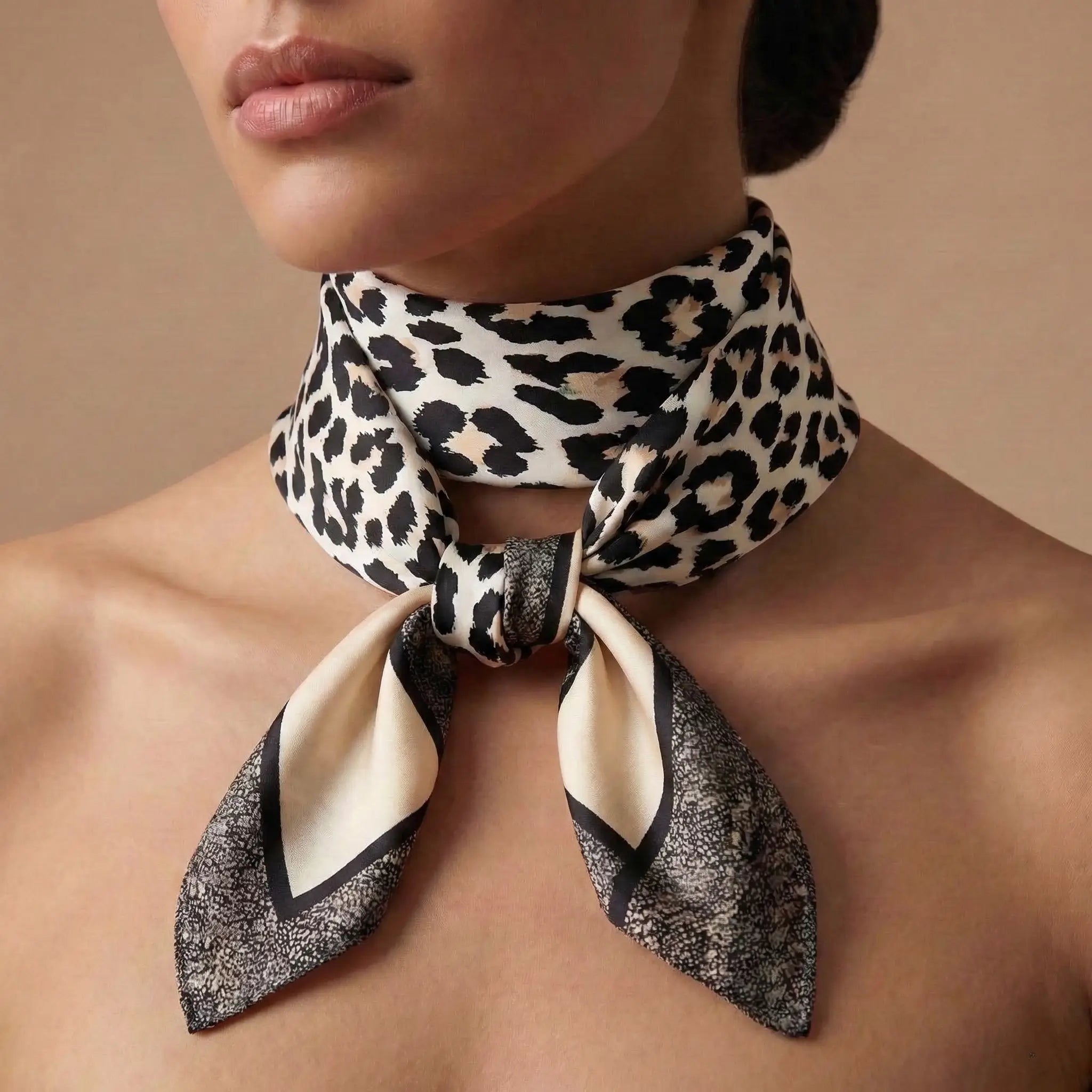 Sleek black and cream leopard print silk scarf with textured border from Leopard Print Scarf collection Image
