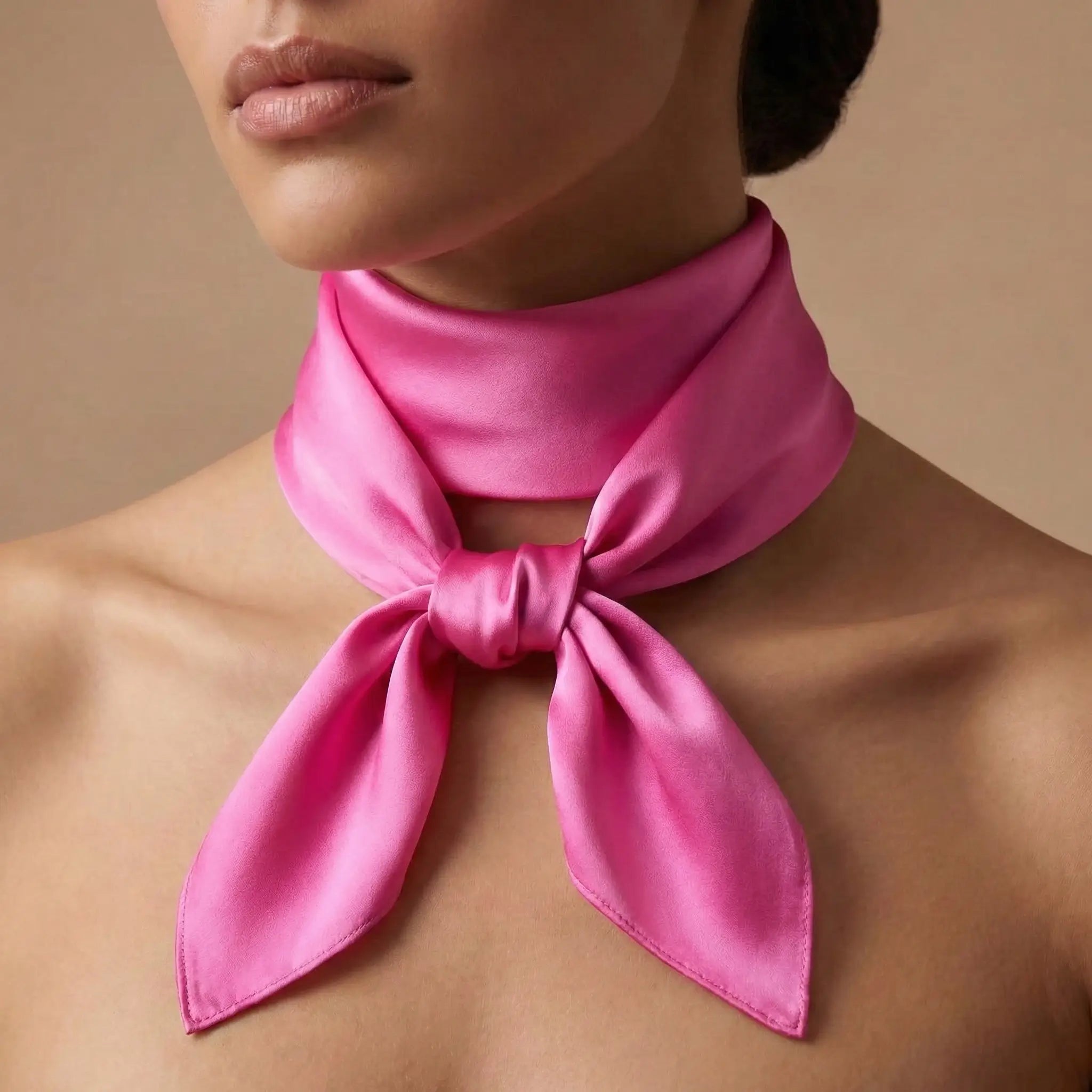 Vibrant pink silk scarf tied in neat bow around neck, Pink Scarf collection Image