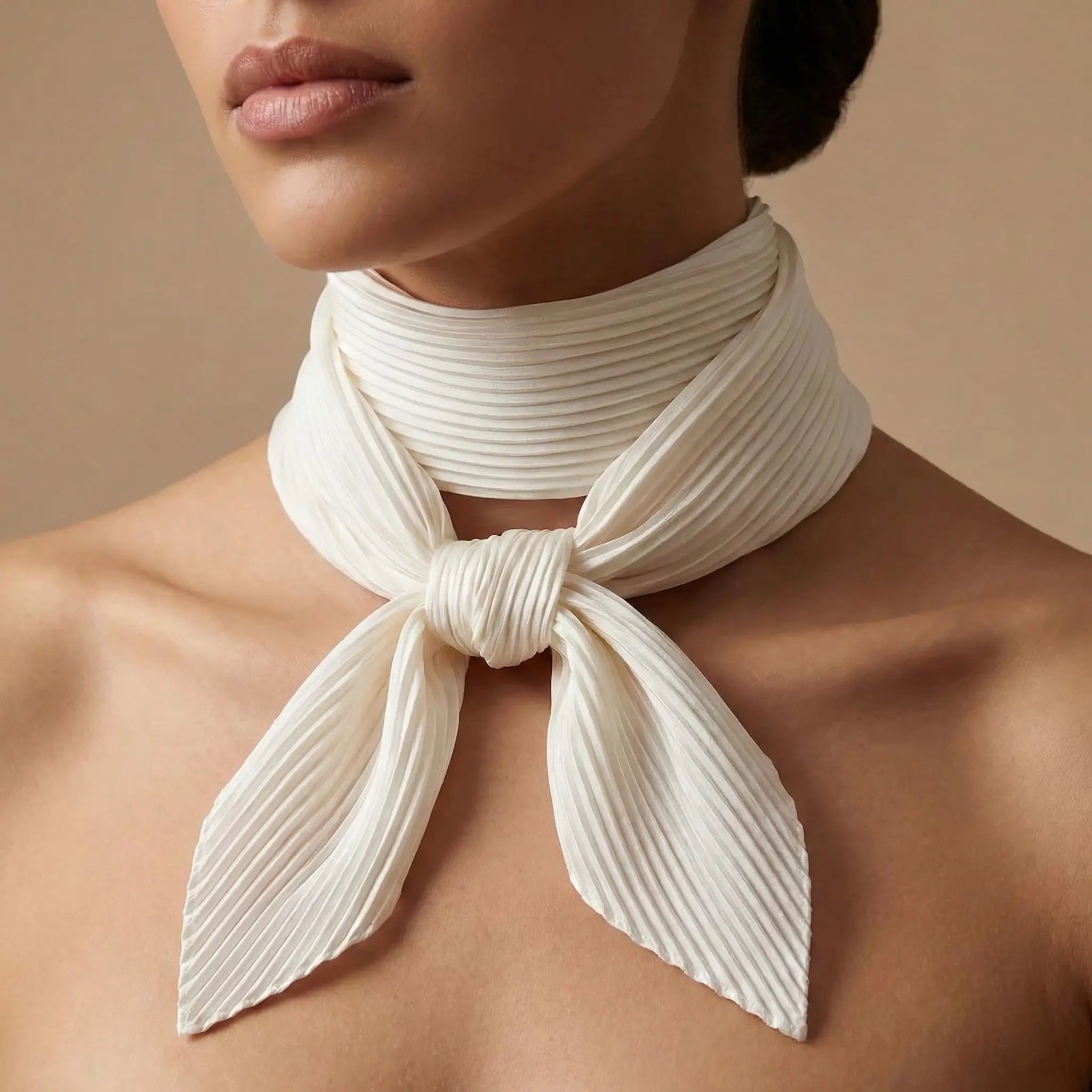 Delicate ivory pleated scarf with neat bow from White Scarf collection Image