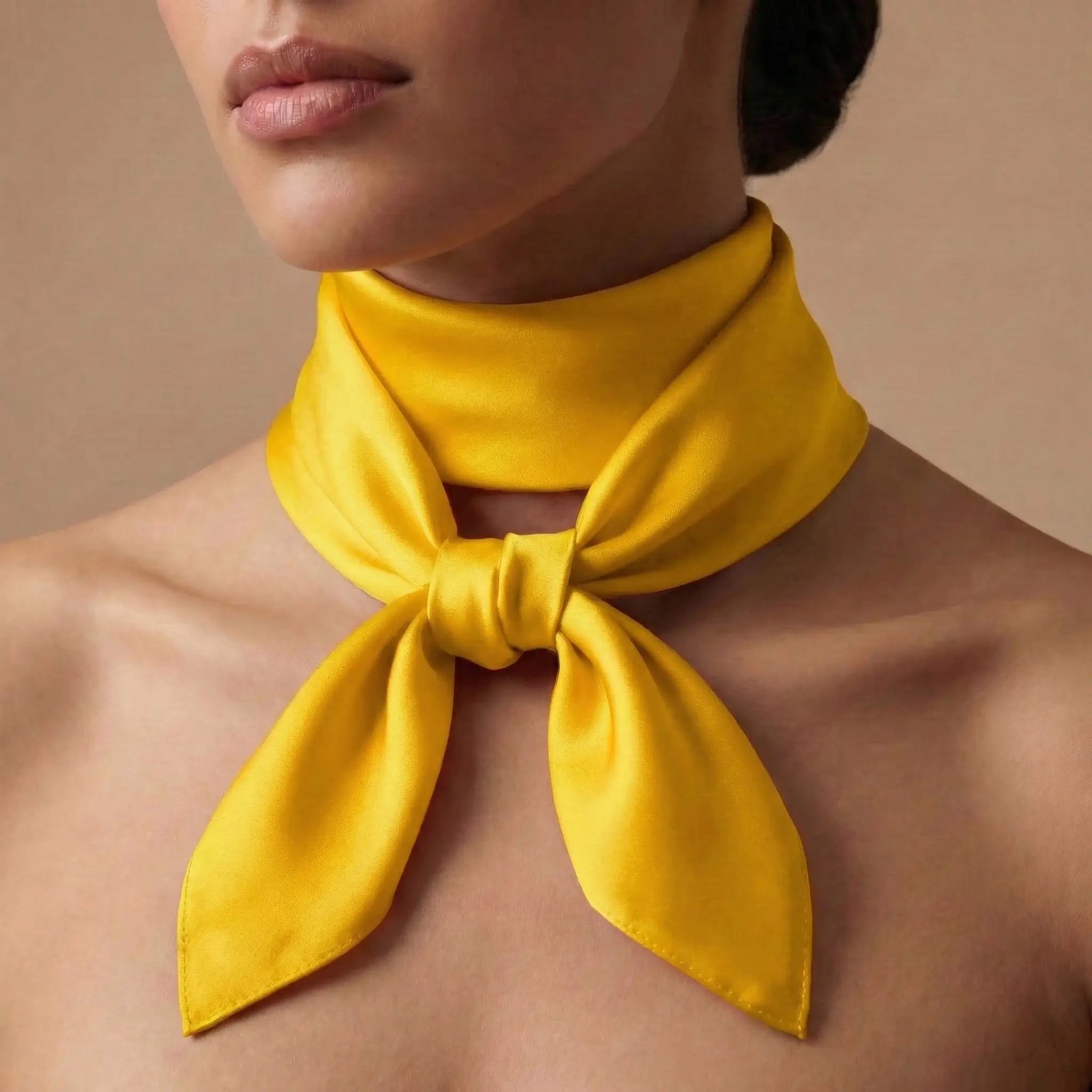 Vibrant yellow silk scarf in neat bow from Yellow Scarf collection Image