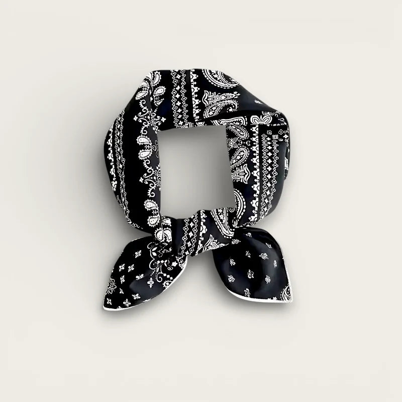 Black bandana-style cotton scarf with white paisley patterns