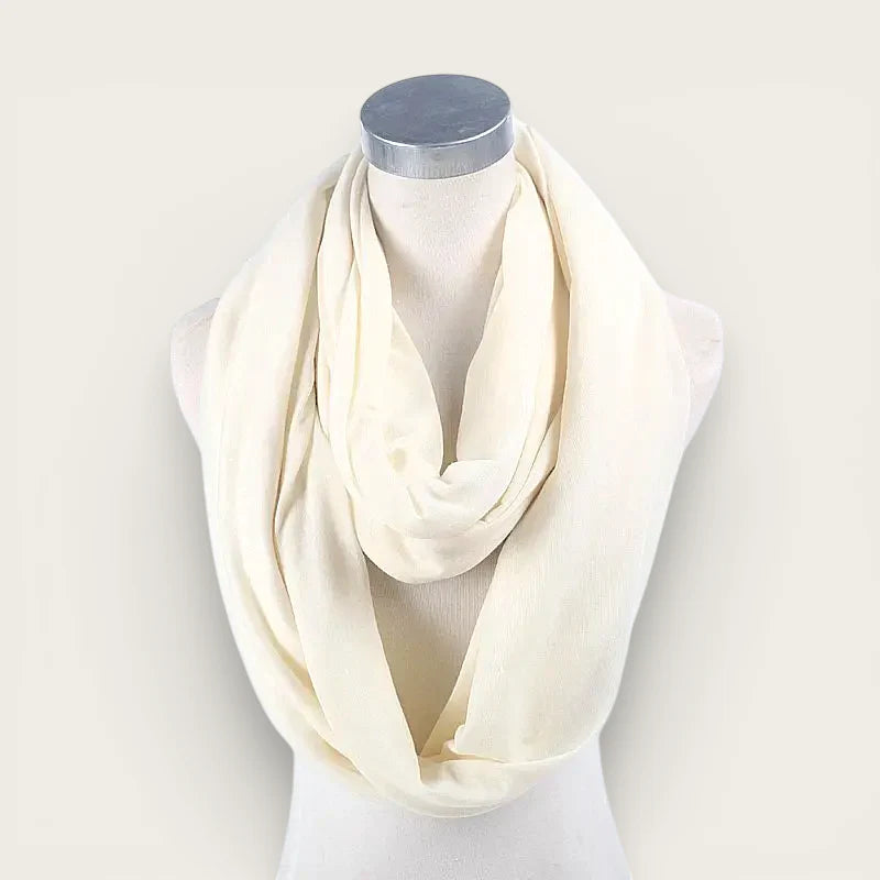 Cream-colored soft infinity scarf draped on mannequin neck
