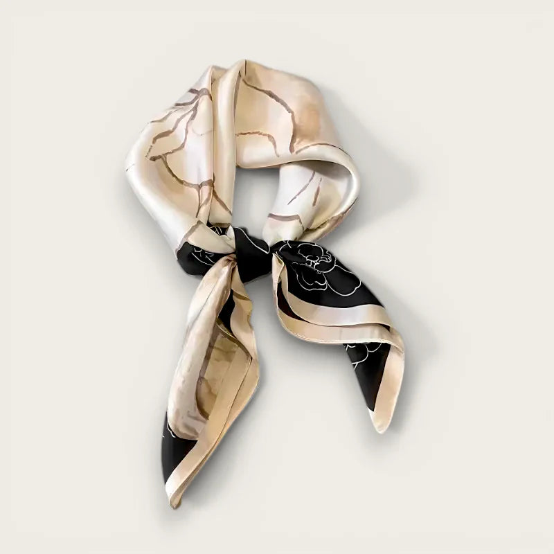Beige square scarf with black floral silk tied in knot
