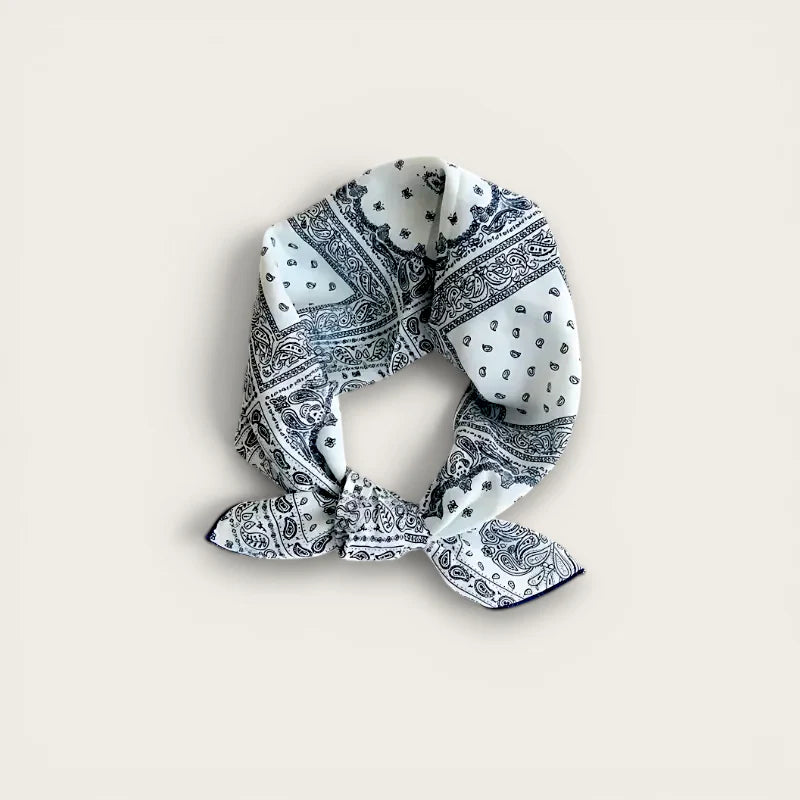 Black and white cotton head scarf with paisley patterns, neatly knotted