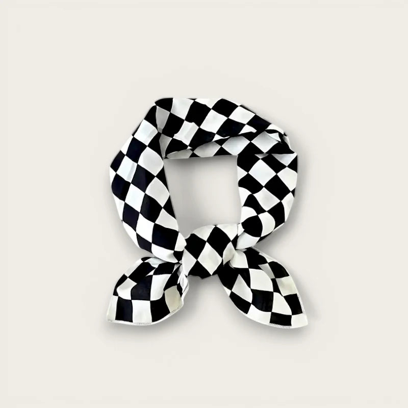 Black and white diamond-patterned cotton scarf tied in a knot