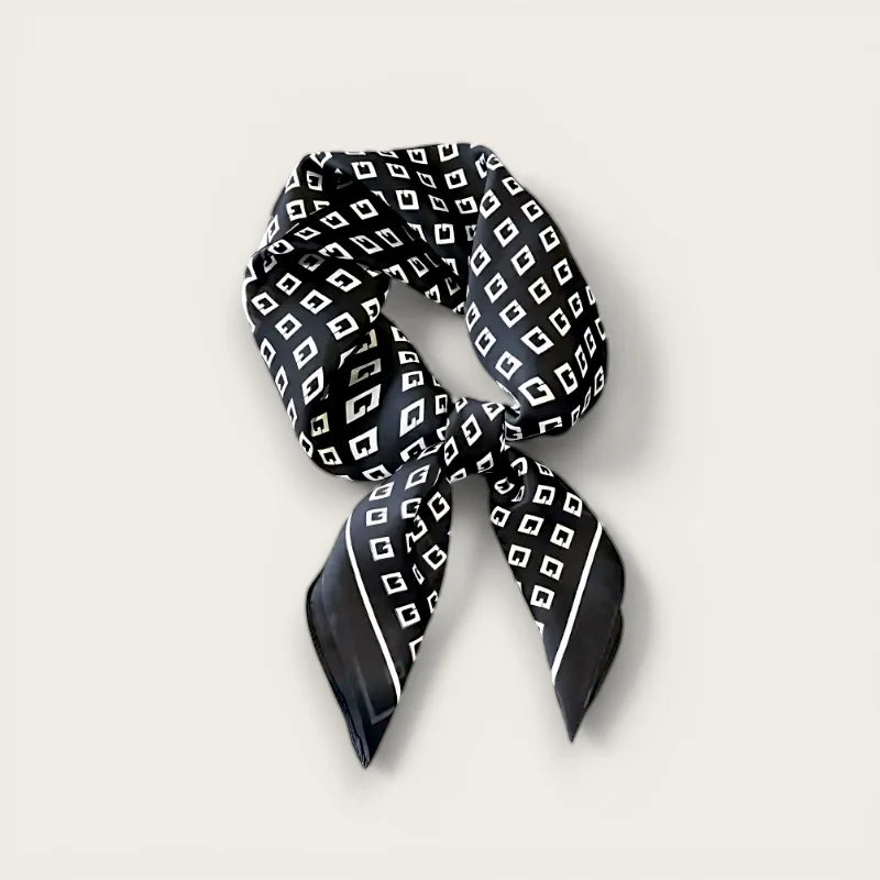 Black and white scarf with silk fabric, repeating geometric pattern and border