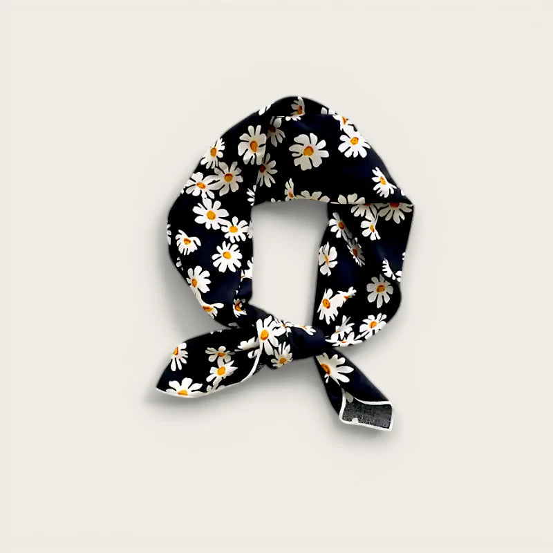 Navy blue silk scarf with white daisies, elegant knot on black cotton head scarf