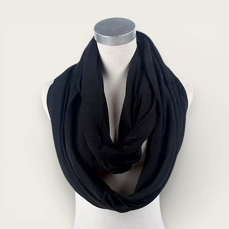 Black infinity scarf draped around a mannequin