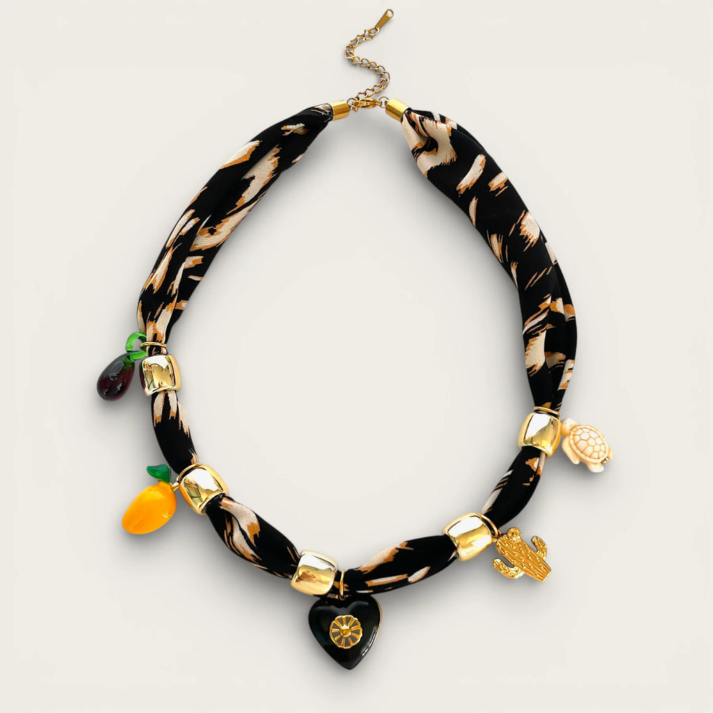 Black scarf necklace with beige zebra print and gold charms
