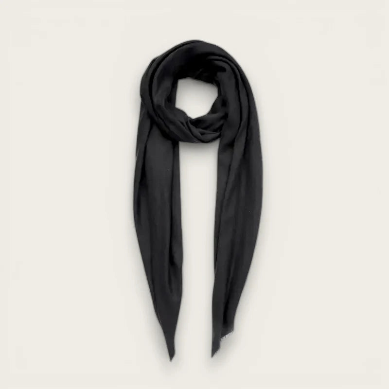 Sleek black wool scarf with soft flowing fabric and neat edges