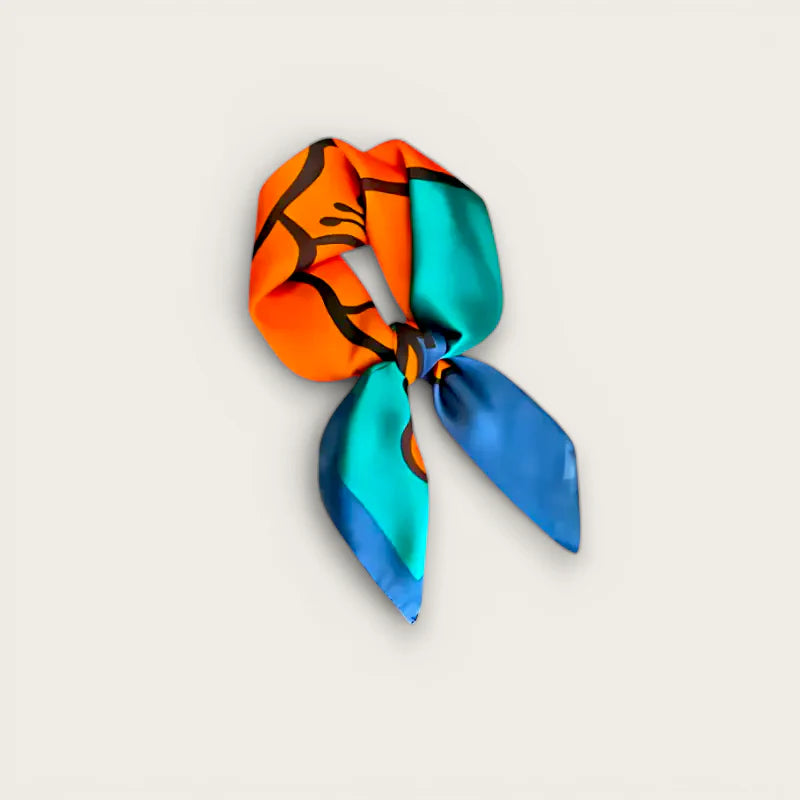 Vibrant orange, teal and blue silk scarf knotted with bold black line art