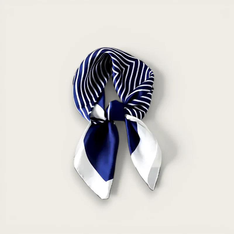 Navy blue and white striped silk scarf tied in knot with pointed ends