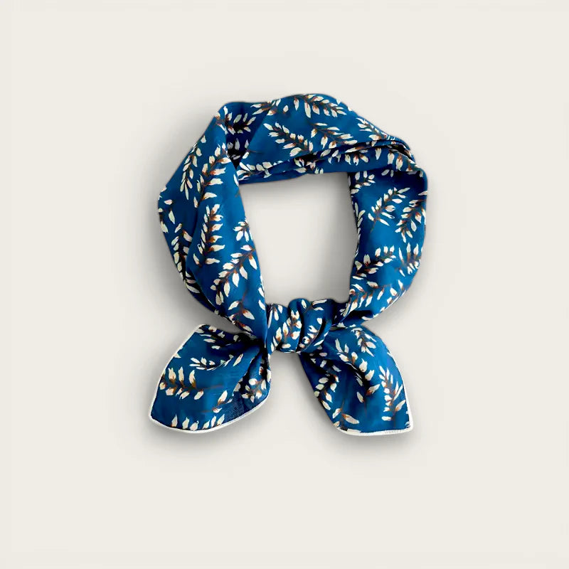 Navy blue silk scarf with white gold leaf pattern in elegant knot