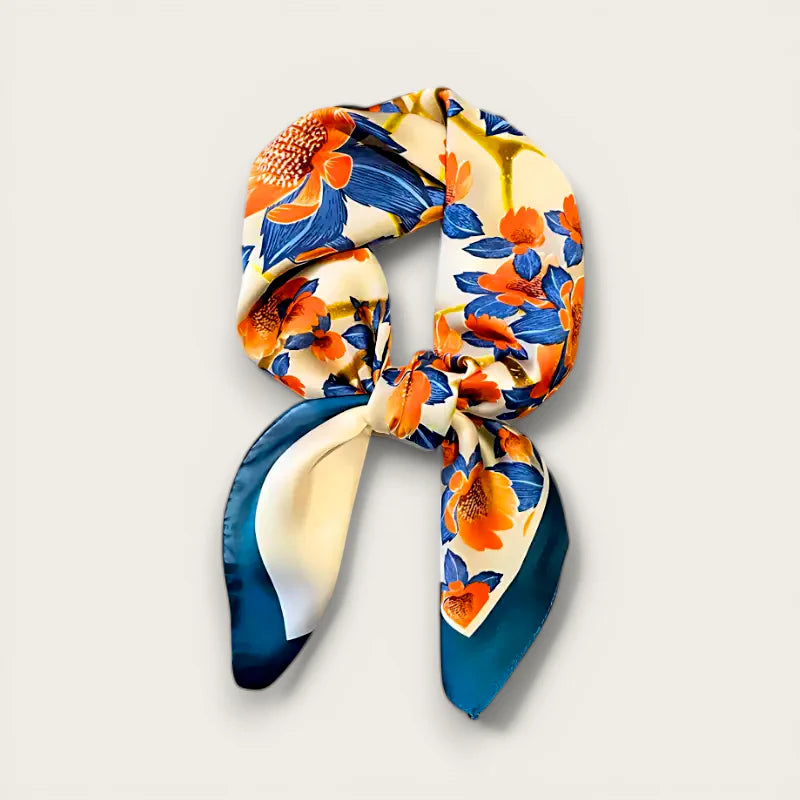 Blue Floral Scarf: vibrant silk in cream, orange, blue tied in neat knot