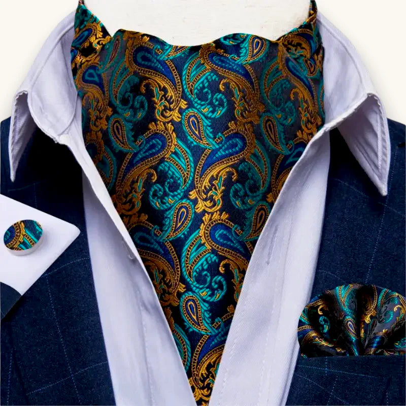 Blue gold paisley ascot scarf draped over white shirt collar