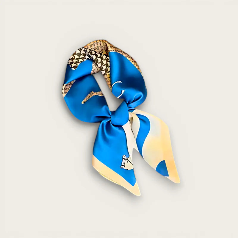 Blue silk scarf with vibrant cartoon character design in elegant knot