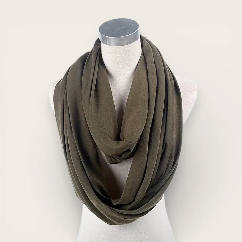 Olive green infinity scarf draped elegantly around mannequin neck