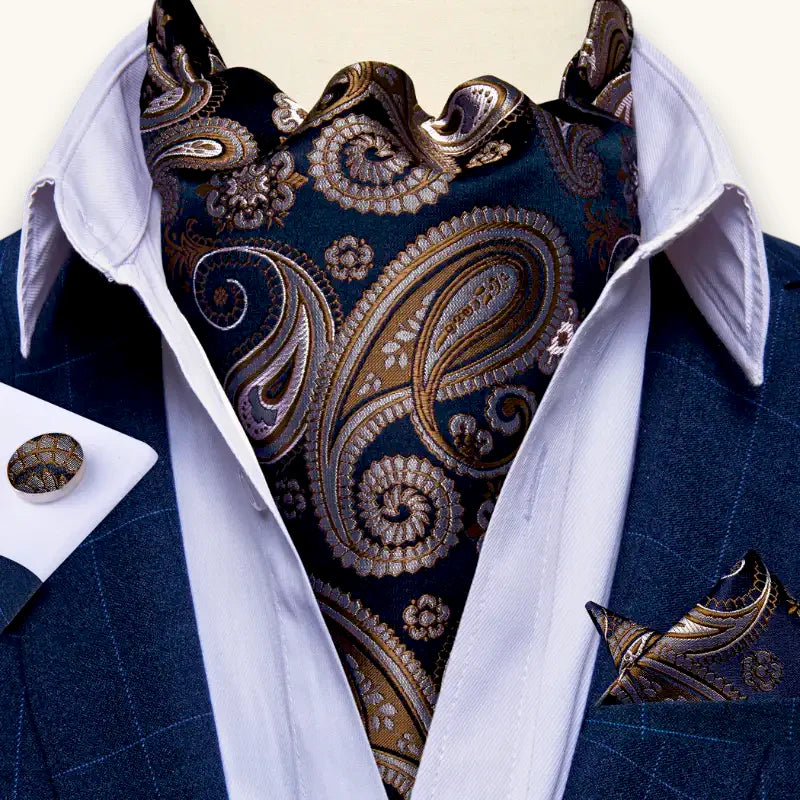 Rich navy blue silk cravat with gold silver paisley on white shirt