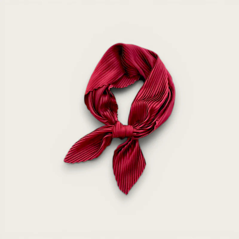 Burgundy silk scarf in rich crimson pleated fabric tied in neat knot