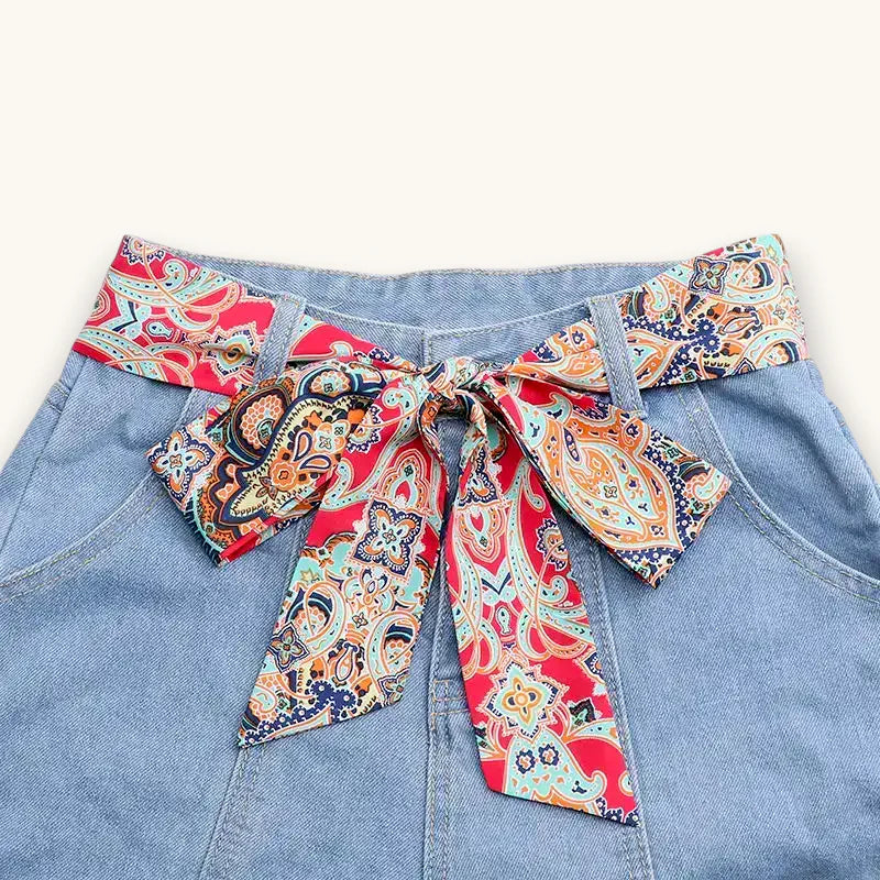 Classic Red Scarf Belt in paisley pattern on denim shorts