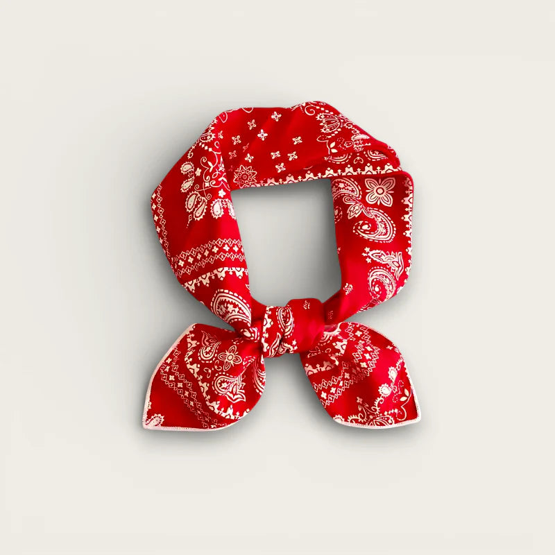 Vibrant red cotton bandana head scarf with white paisley floral pattern in bow