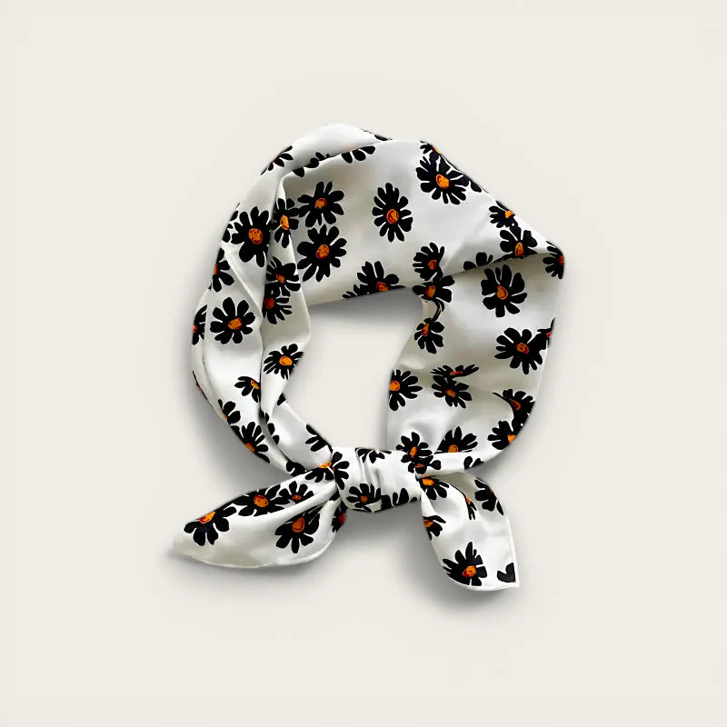 White silk scarf with black daisies and orange centers, knotted, Cotton Gauze Scarf