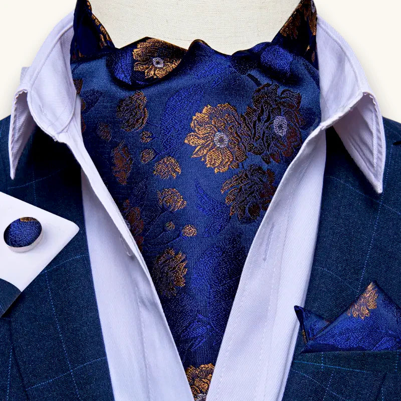 Dark blue ascot tie with gold floral embroidery and shimmer