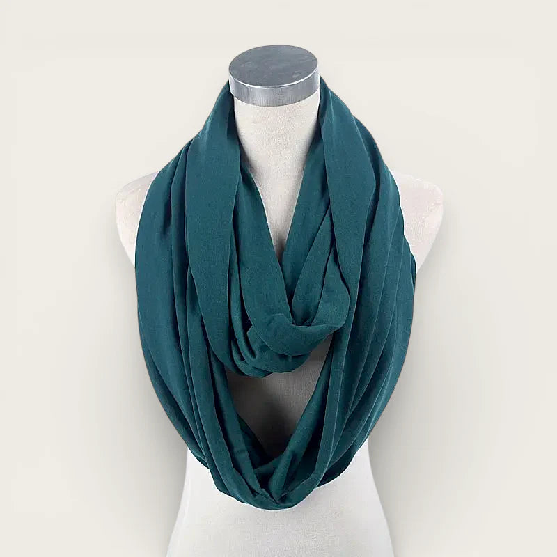 Teal soft fabric infinity scarf draped on mannequin