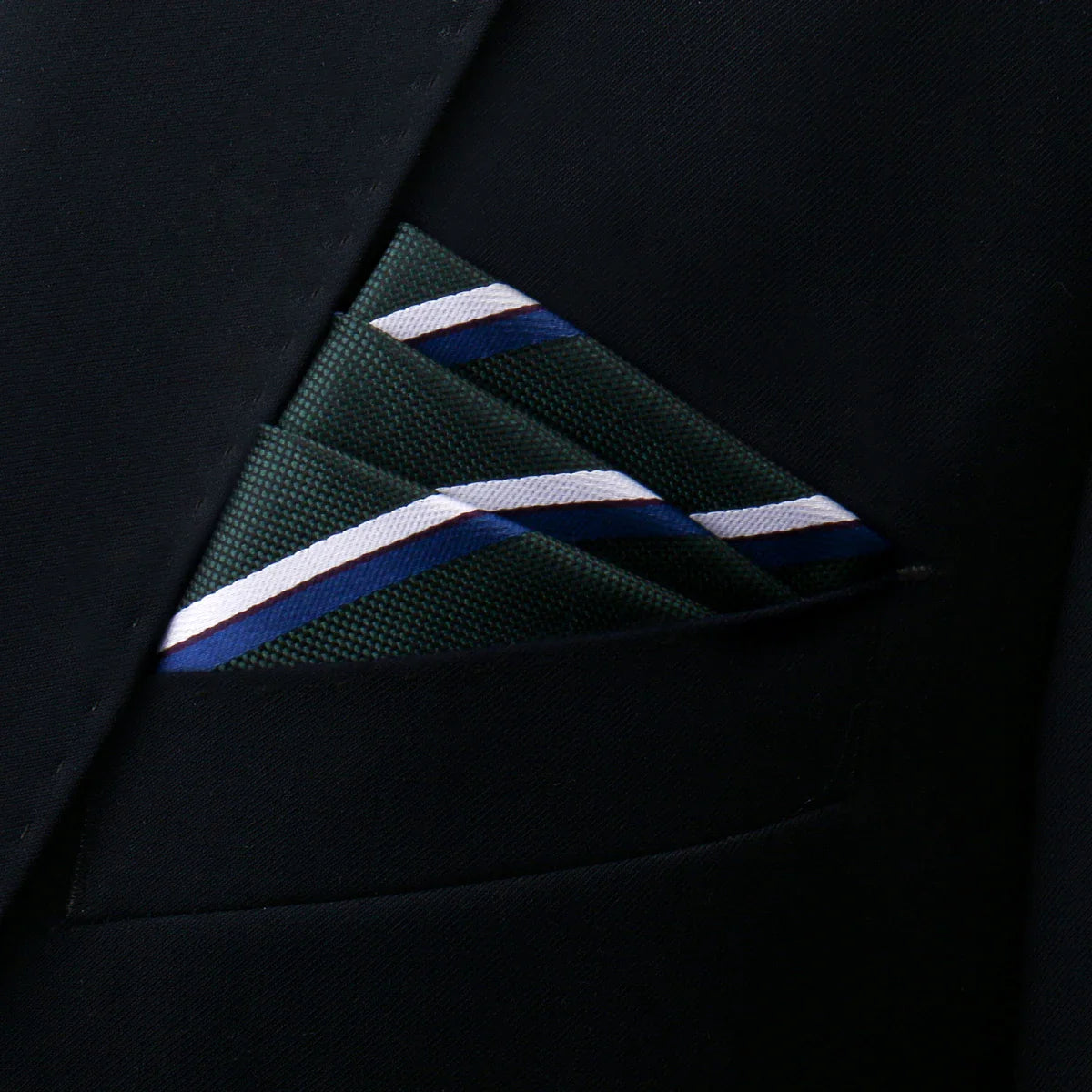 Dark green pocket square with white navy stripes in suit pocket