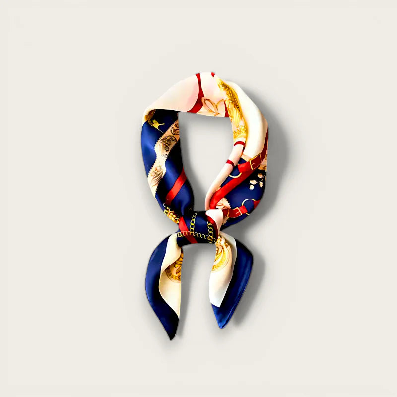Designer silk scarf in navy blue, cream, red with gold-accented equestrian print
