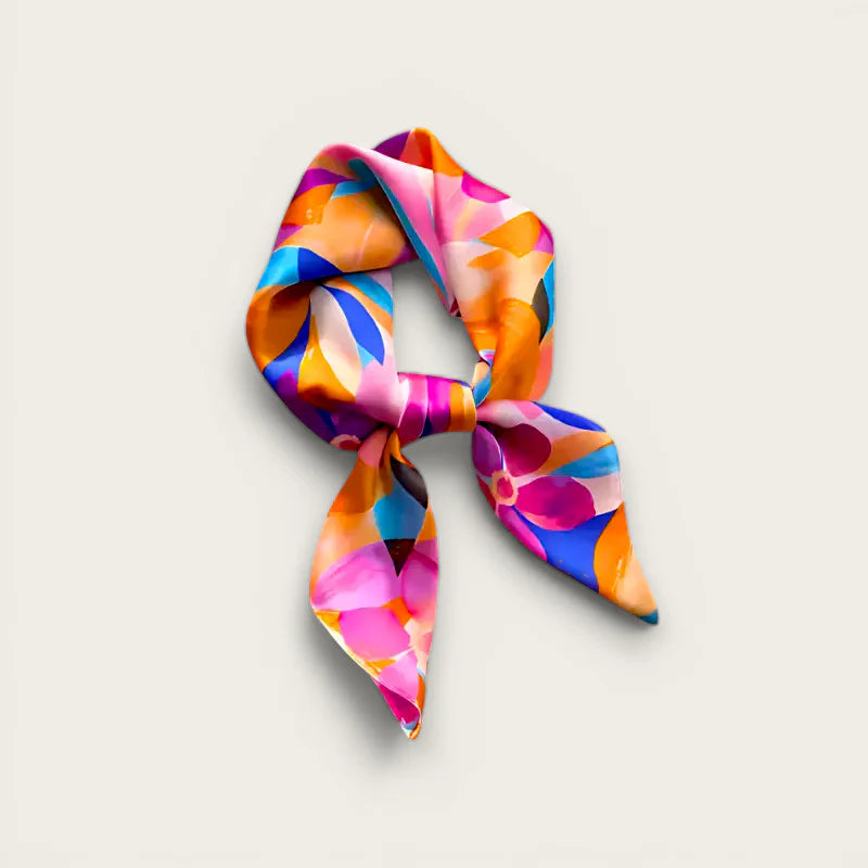 Floral silk scarf in vibrant orange, pink, blue, purple abstract pattern, knotted