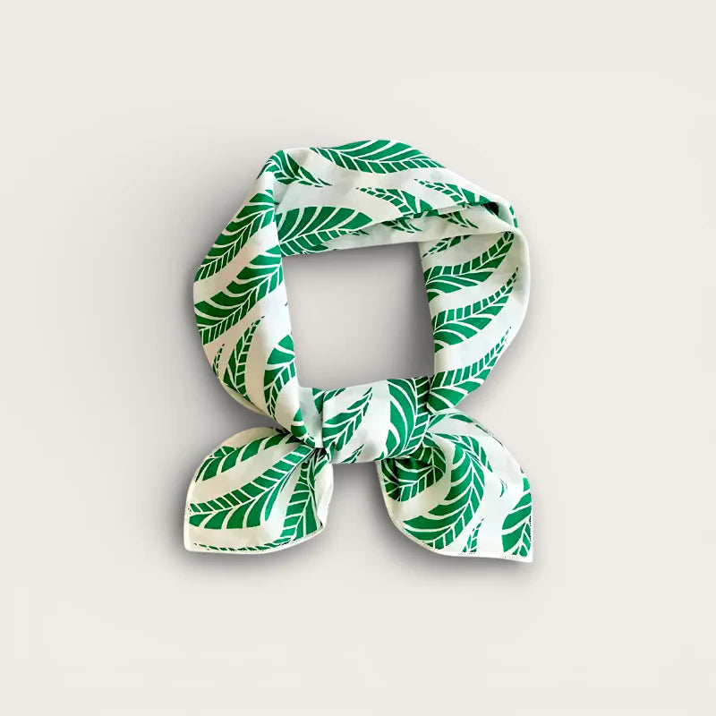 Green cotton head scarf with white silk and vibrant leaf pattern knot