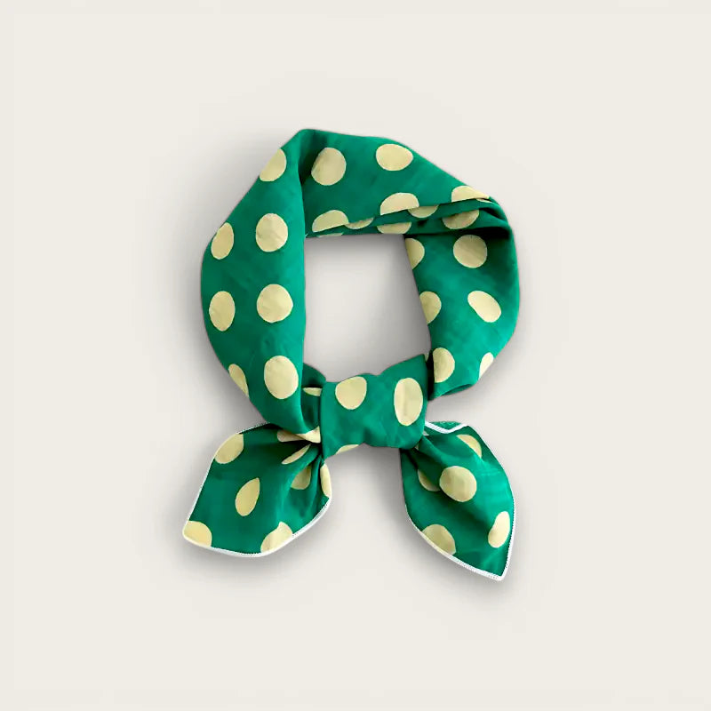 Green polka dot cotton scarf in vibrant silk with cream dots and white trim bow
