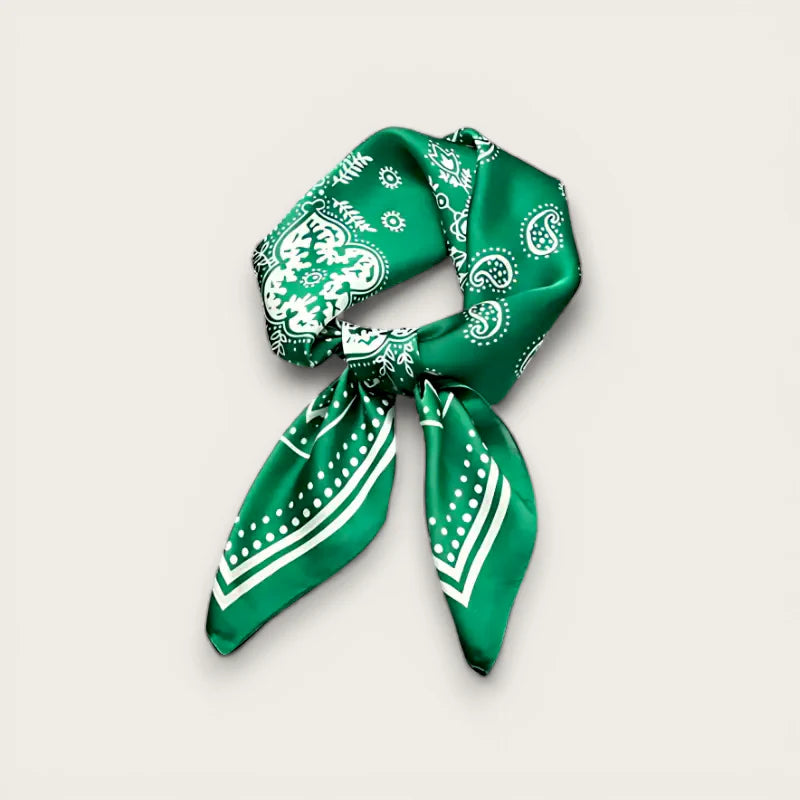 Vibrant emerald green satin scarf with white paisley pattern in elegant knot