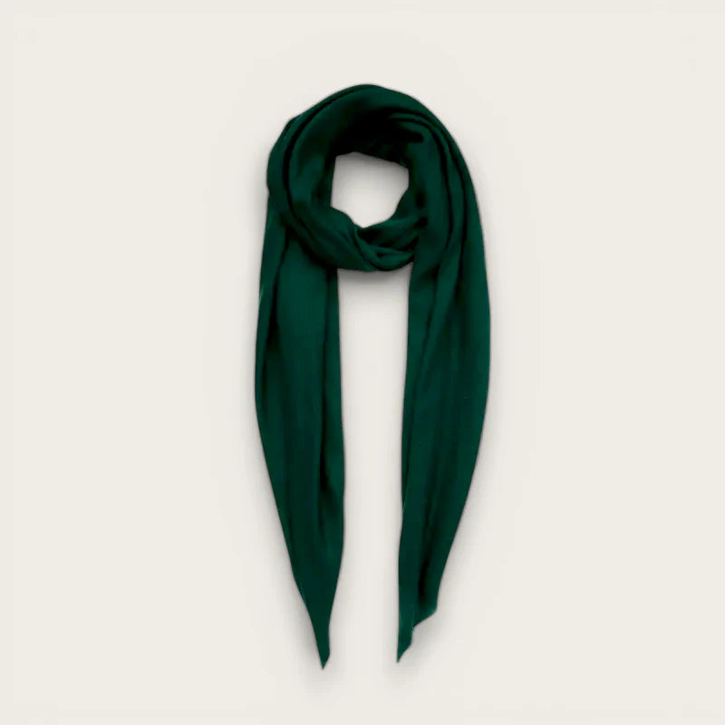 Deep emerald green silk scarf elegantly draped and folded