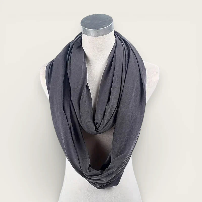 Grey infinity scarf draped elegantly on mannequin neck