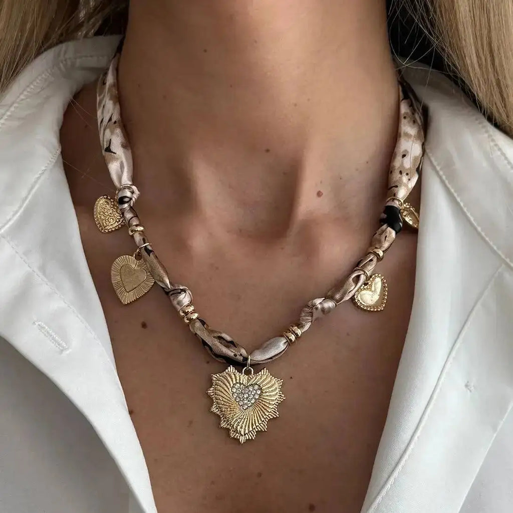 Heart Scarf Necklace with gold sunburst pendant and sparkling stones
