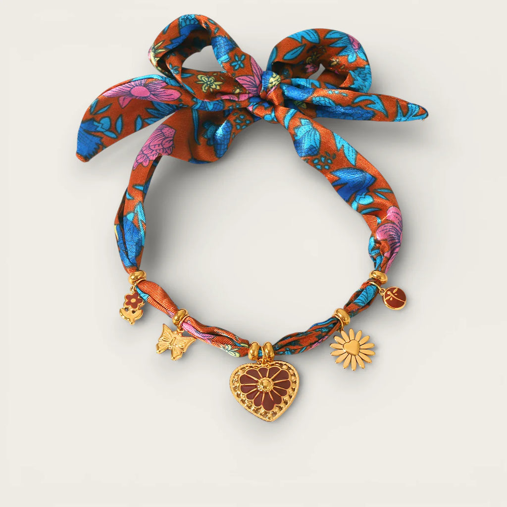 Vibrant orange blue floral silk ribbon bracelet with gold heart butterfly sun charms