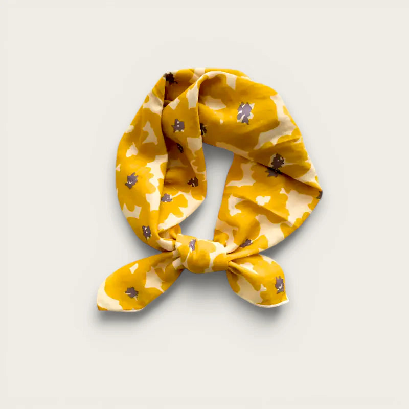 Ladies yellow cream silk square scarf with brown floral motifs tied in knot