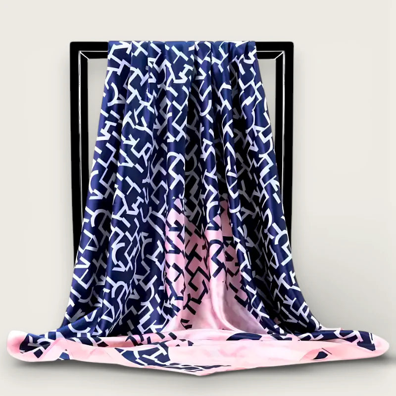 Large blue and pink silk scarf with white geometric pattern on black frame