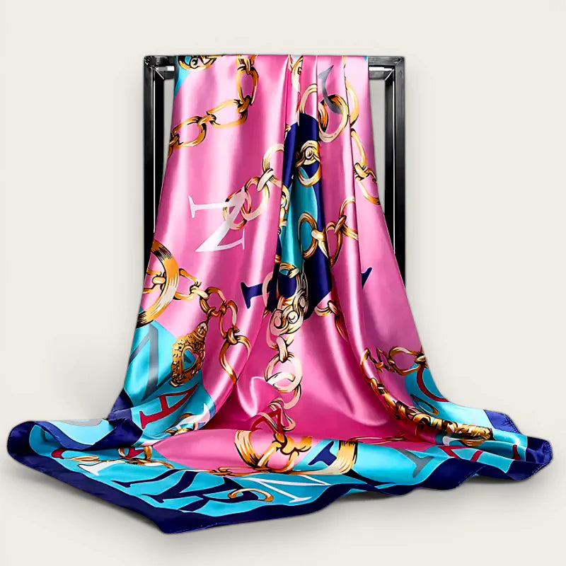 Large designer silk scarf in vibrant pink turquoise with gold chain motifs
