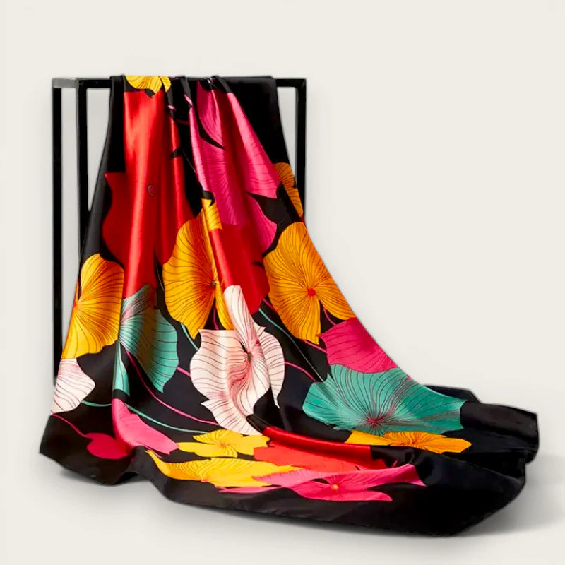 Large format satin scarf with vibrant floral silk blossoms in red, yellow, pink, teal on black
