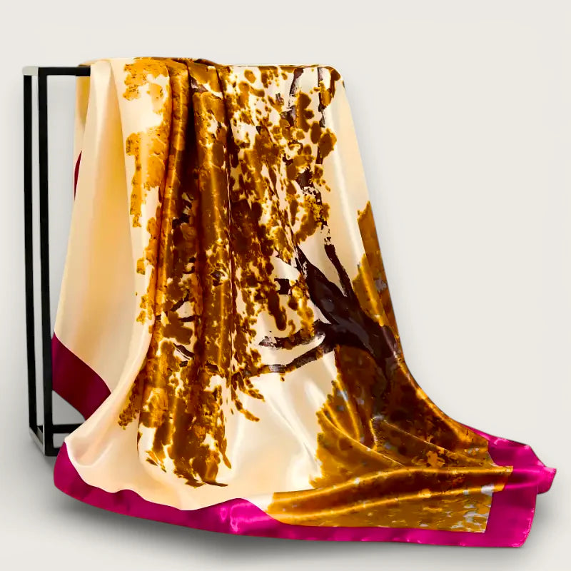 Large printed scarf in cream silk with gold-brown tree branches, fuchsia trim