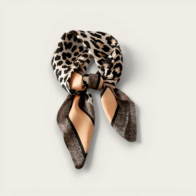 Leopard Head Scarf with sleek leopard-print silk, gold and black accents in stylish knot