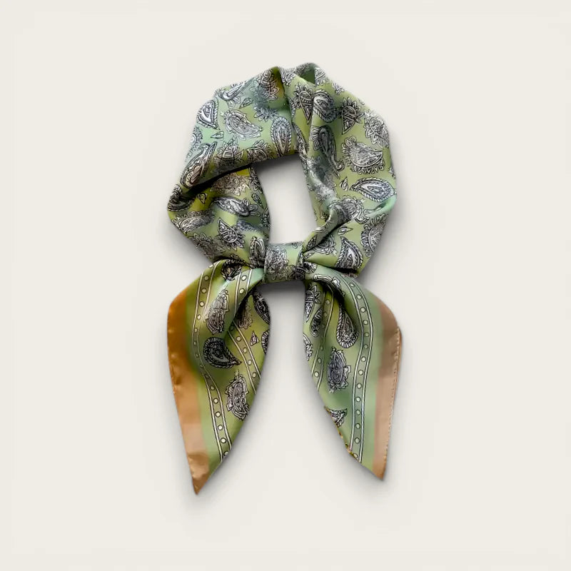 Light green silk scarf with paisley pattern and gold trim in elegant knot
