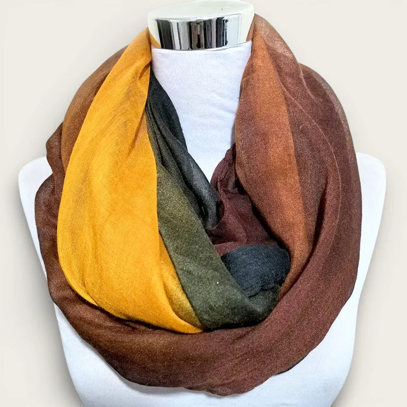 Light infinity scarf in mustard yellow, olive green, gray, brown on mannequin
