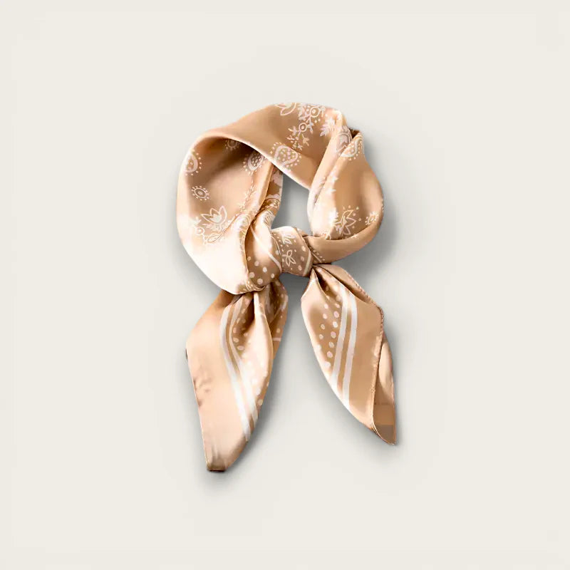 Light pink scarf with beige silk paisley dot pattern in elegant knot