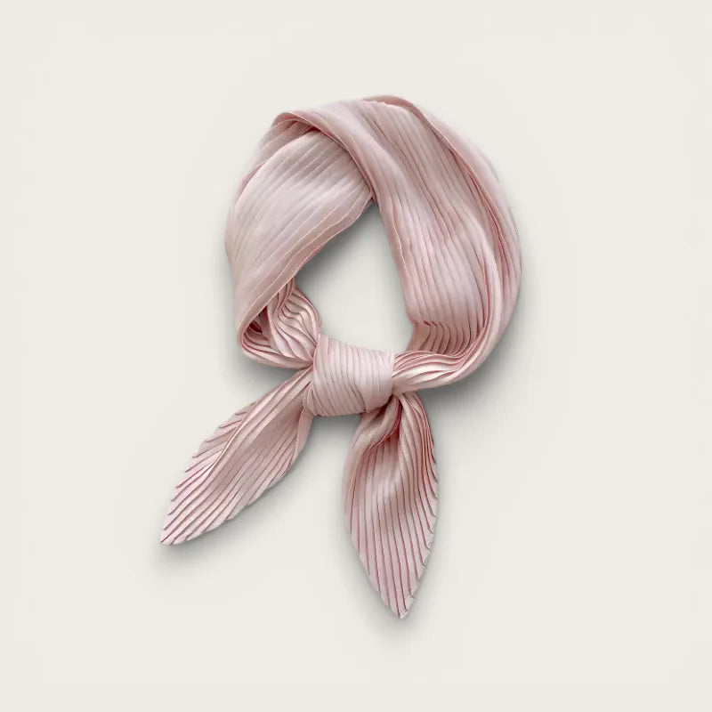 Light pink silk scarf with delicate pleated fabric tied in neat knot